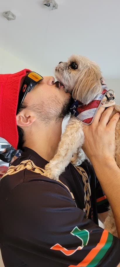 Paris in her flag bandana getting a kiss on the Fourth of July.