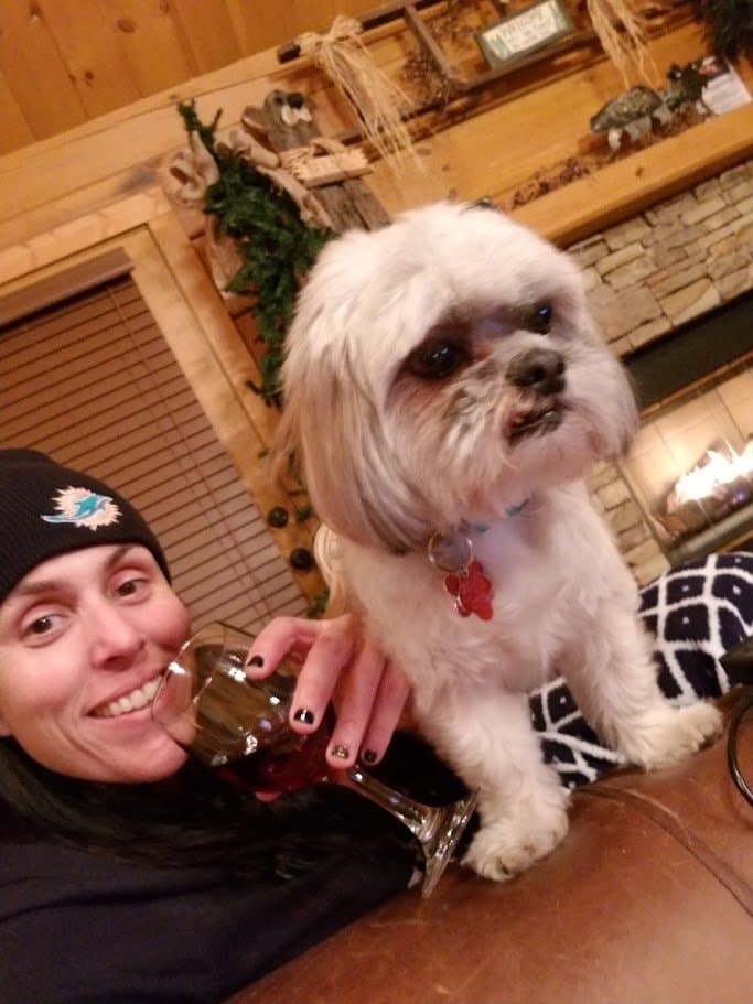 Momma and Paris relaxing by the fire in the cabin.